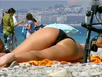The sleeping female in the black bikini cant even imagine that her ass butts get spied on the kinky guys camera!