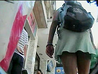 The college girl is walking and having no idea that her upskirt black panty is seen to our guy with camera.