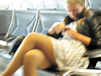 The teen looking amateur is sitting in the waiting room of the station allowing the cameraman record her beautiful sitting upskirt