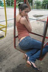 Katerina on playground in tight jeans