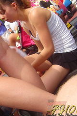 Young hottie caught in a crowd. Upskirts pics