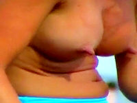 The rock hard nipples of this sun tanning lady look no less hot than her wonderful bikini panty.