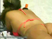 Babe in the red string bikini got the camera recording right between her legs.