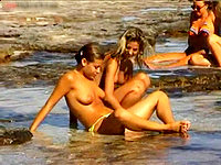 The sweet looking babes in bikini panties are taking the sea-water bath!
