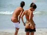 The guy with cameras hid in the bushes and enjoyed these slim babes in tiny string bikinis.