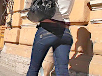Wow, I really like her tight ass jeans! They look pretty unusual and show off the girl's delicious butt and well-shaped legs