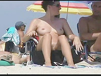 Nudist on beach is demonstrating her nude cunt and tits for the pleasure and hot fun of all viewers on the net!