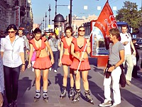 Cute roller skaters are wearing the exclusively short uniforms that never cover their sexy teen up skirts while they are in the crowd